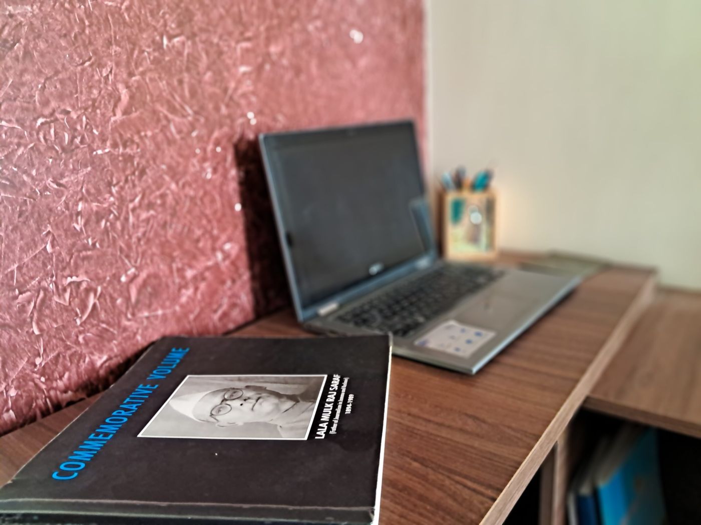 The commemorative volume for Lala Mulk Raj Saraf, 1894-1989, resting on a desk