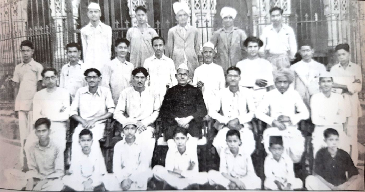Archival black-and-white group photograph of an early press gathering in Jammu & Kashmir